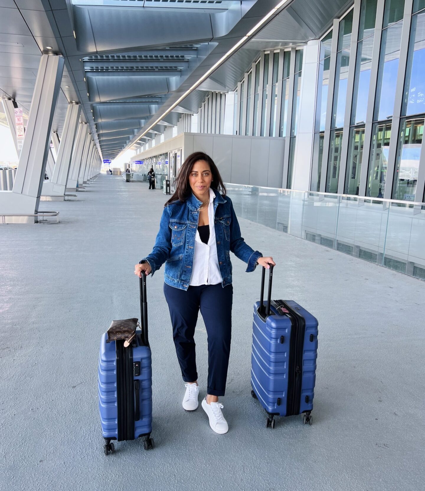 blue luggage at an airport