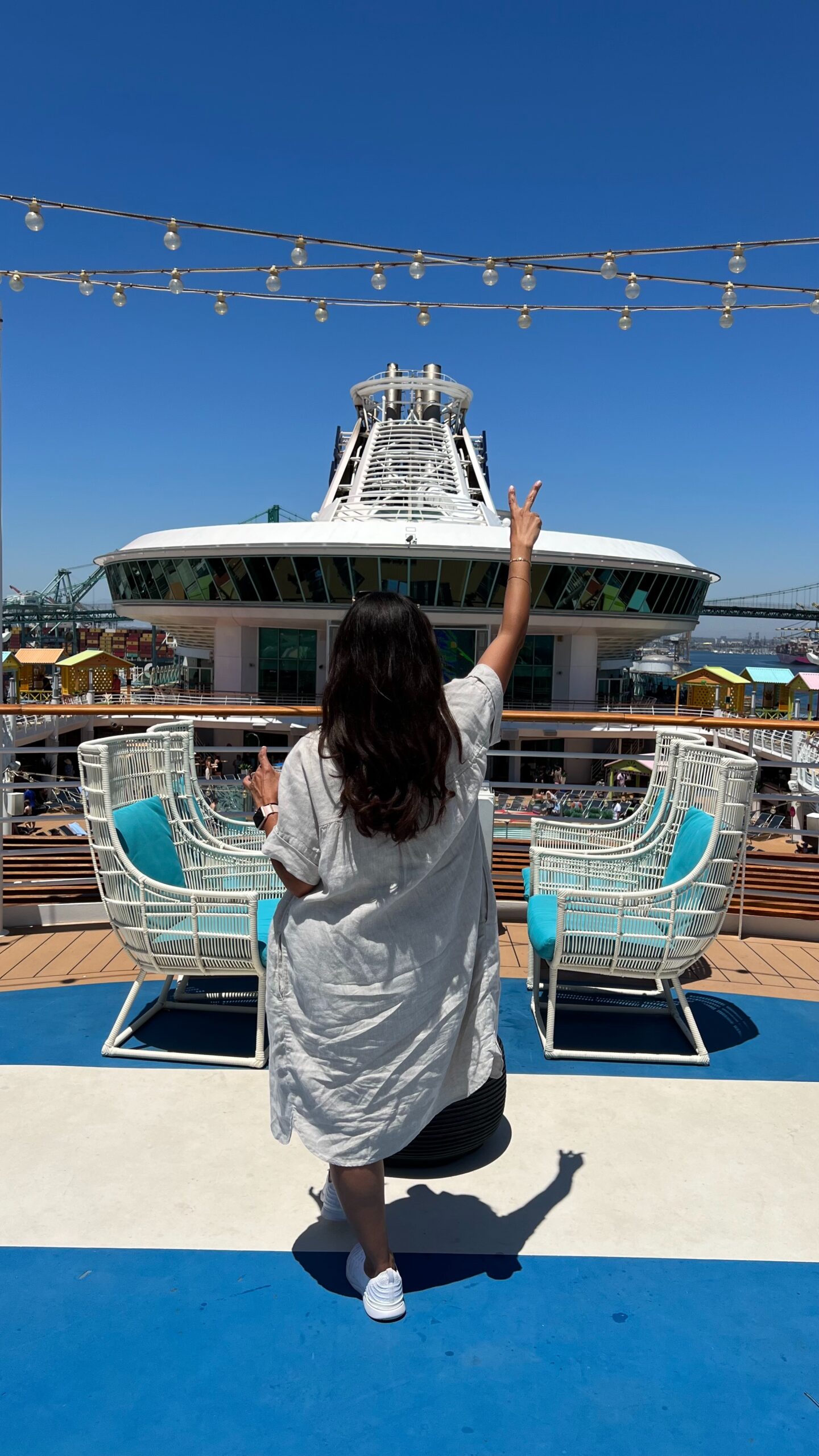 cruise ship point of view with person with a drink in hand